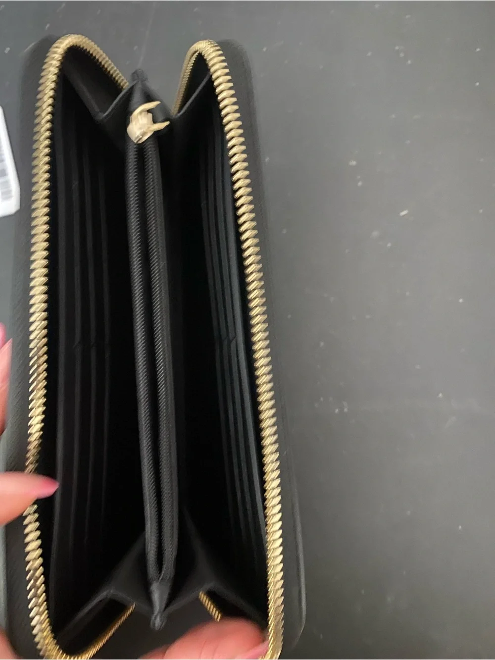 kate spade Black Saffiano Zip-Around Wallet with Gold Logo